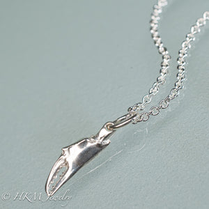 close up front view of mini lady crab claw necklace cast in recycled silver in a polished finish by hkm jewelry