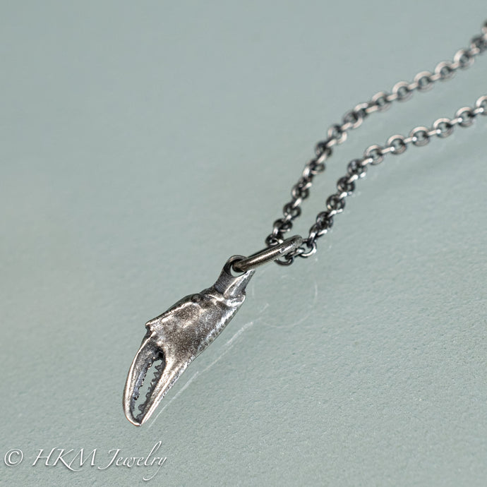 mini lady crab claw necklace cast in recycled silver in an oxidized finish by hkm jewelry