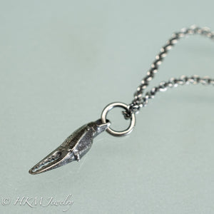 side view of mini lady crab claw necklace cast in recycled silver in an oxidized finish by hkm jewelry