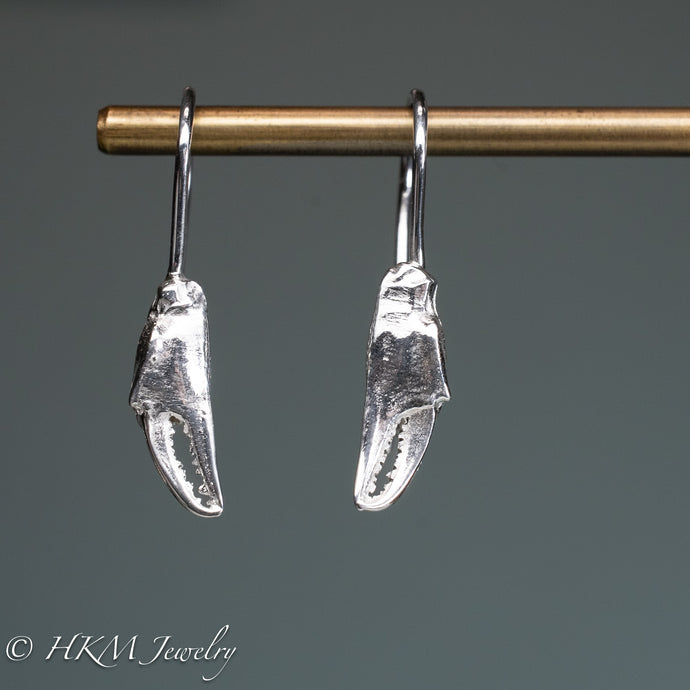 cast silver lady crab claw drop earrings by hkm jewelry