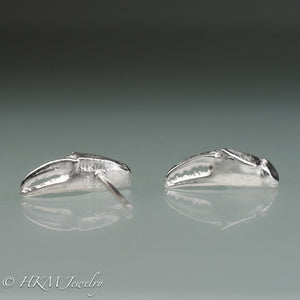 front and back view of cast silver lady crab claw stud earrings by hkm jewelry