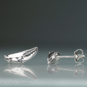 front and side view of cast silver lady crab claw stud earrings by hkm jewelry