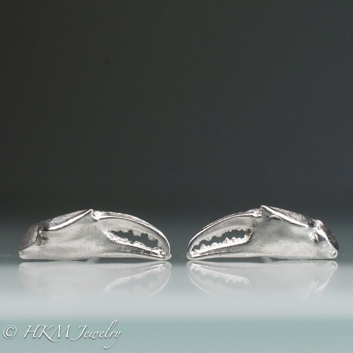 front view close up of cast silver lady crab claw stud earrings by hkm jewelry