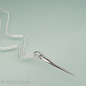 mini horseshoe crab tail necklace in sterling silver by hkm jewelry