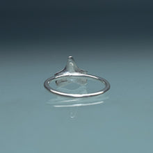 Load image into Gallery viewer, back view of cast silver small shark tooth ring on blue gradient background
