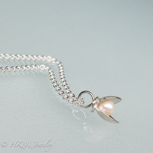 side view of mini bay scallop necklace with pearl inset by hkm jewelry