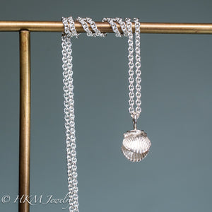 mini bay scallop necklace by hkm jewelry on brass display