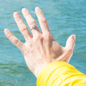 model wearing small size key hole limpet ring by hkm jewelry in oxidized silver finish