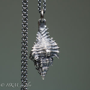 close up back side of close up of chicoreus florifer - Lace Murex shell necklace in sterling silver by hkm jewelry oxidized finish
