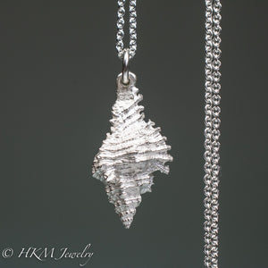 close up back side of close up of chicoreus florifer - Lace Murex shell necklace in sterling silver by hkm jewelry polished finish
