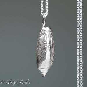 back side of large cast silver oliva sayana - Lettered Olive necklace by hkm jewelry in sterling silver