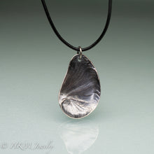 Load image into Gallery viewer, Naticidae moon snail operculum cast in sterling silver on leather cord by hkm jewelry
