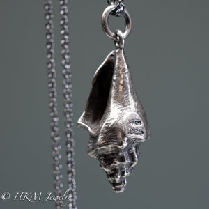 close up of side view of hallmark .925 and HKM makers mark stamp on queen conch necklace in oxidized silver by hkm jewelry