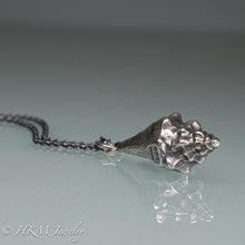 Load image into Gallery viewer, close up  view of juvenile queen conch necklace in oxidized silver by hkm jewelry

