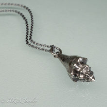 Load image into Gallery viewer, close up back view of juvenile queen conch necklace in oxidized silver by hkm jewelry
