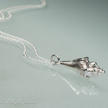Load image into Gallery viewer, close up of side view of juvenile queen conch necklace in polished silver by hkm jewelry
