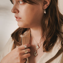 Load image into Gallery viewer, Close-up of a woman wearing jewelry with a neutral background
