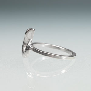 side view of cast sterling silver rams horn squid spirula shell spiral ring by hali maclaren of hkm jewelry