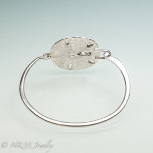 underside view of molded and cast real sand dollar cuff bracelet in recycled sterling silver by hkm jewelry
