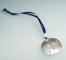 Load image into Gallery viewer, cast silver sand dollar ornament from stone harbor nj with freshwater pearl and navy blue satin ribbon by hkm jewelry on blue background
