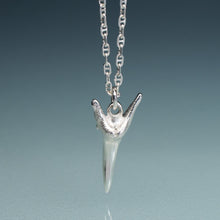 Load image into Gallery viewer, silver shark tooth necklace on anchor chain with teal gradient background
