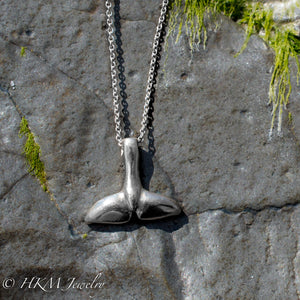 top side of silver dolphin tail necklace by hkm jewelry 