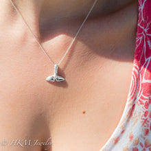 Load image into Gallery viewer, top side of silver whale tail necklace by hkm jewelry on model
