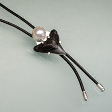 Load image into Gallery viewer, delicate unisex bolo tie with shark tooth fossil and freshwater pearl on thin leather cord
