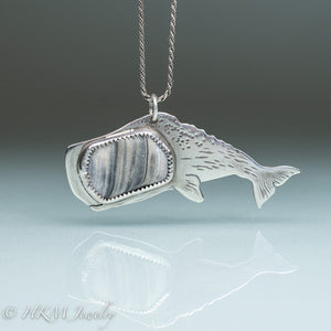 sperm whale necklace by hkm jewelry in recycled sterling silver and bezel set fossil clam shell piece hammer textured details and hand sawn 