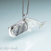 Load image into Gallery viewer, side view of sperm whale necklace by hkm jewelry in recycled sterling silver and bezel set fossil clam shell piece
