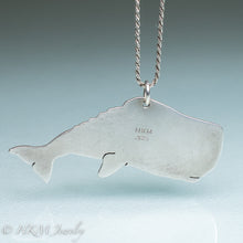 Load image into Gallery viewer, back view of sperm whale necklace by hkm jewelry in recycled sterling silver and bezel set fossil clam shell piece
