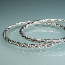 Load image into Gallery viewer, close up detail of two sterling silver twist rope bangles by hkm jewelry
