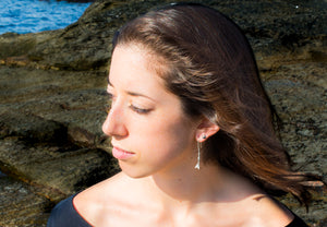 Caryle modeling the oxidized mini clam shell studs by hkm jewelry