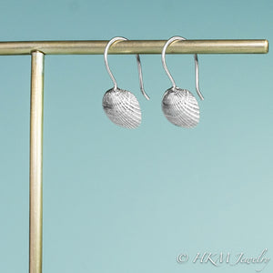 side view of the ark clam seashell dangle earrings by hkm jewelry in sterling silver