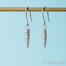 Load image into Gallery viewer, side close up view of auger snail shell dangle earrings in polished silver by hkm jewelry 
