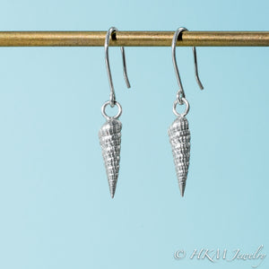 side close up view of auger snail shell dangle earrings in polished silver by hkm jewelry 
