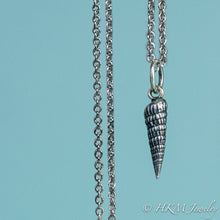 Load image into Gallery viewer, close up front view of the auger snail shell necklace in oxidized silver by hkm jewelry

