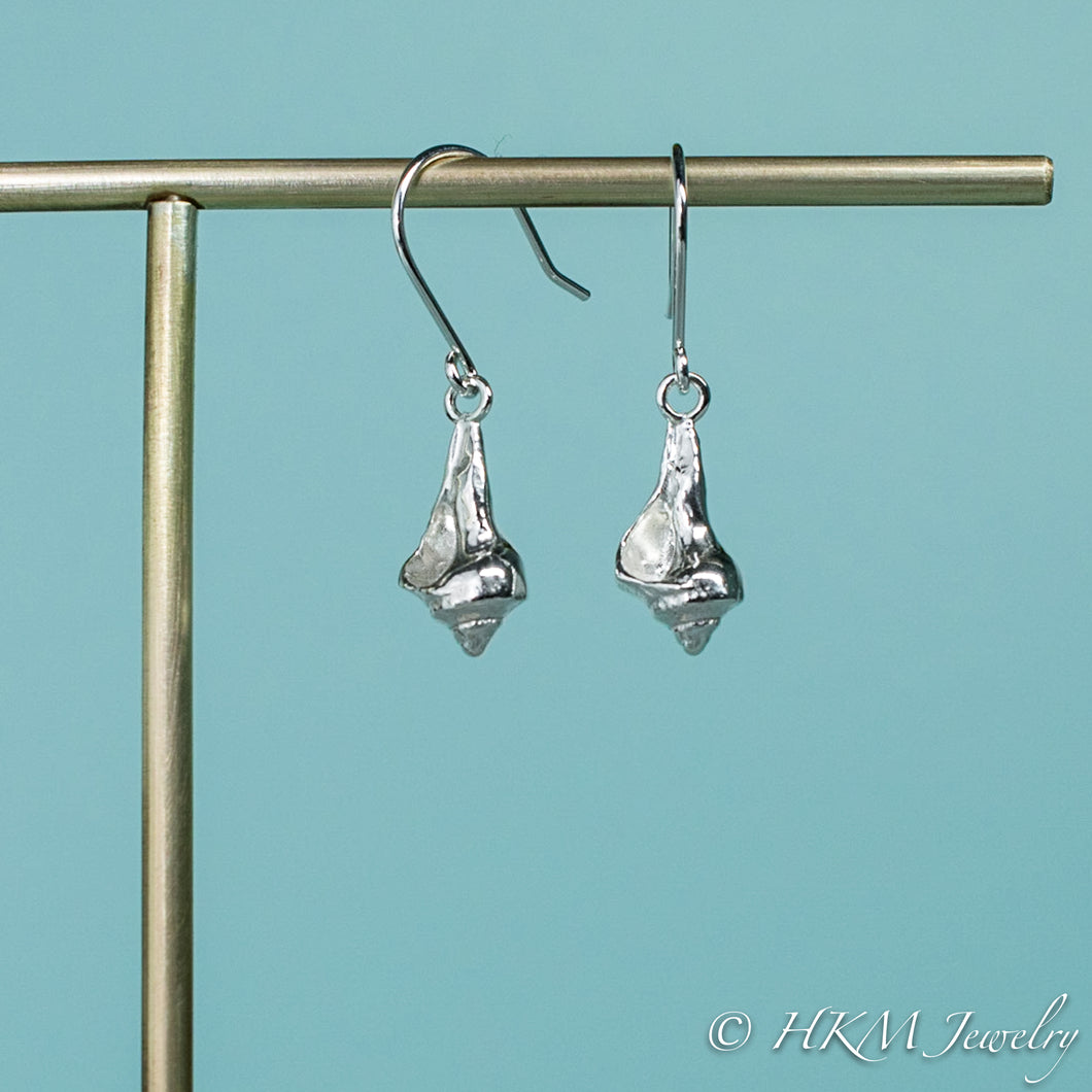 side and front view of the baby knobbed whelk dangle earrings in sterling by hkm jewelry