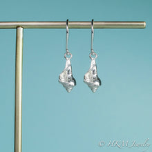 Load image into Gallery viewer, close up front view of the baby knobbed whelk dangle earrings in sterling by hkm jewelry
