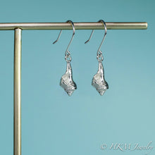 Load image into Gallery viewer, close up side view of the baby knobbed whelk dangle earrings in sterling by hkm jewelry
