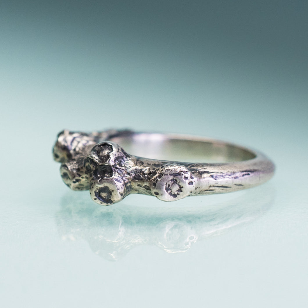 carved and cast coral and barnacle ring in oxidized silver by hkm jewelry