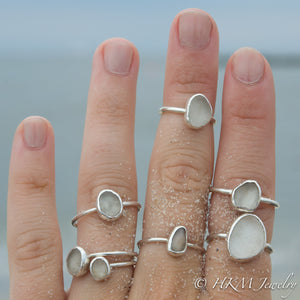 model wearing small medium and large bezel set raw cape may diamond rings in sterling silver by HKM Jewelry