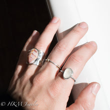 Load image into Gallery viewer, model wearing large bezel set raw cape may diamond ring in sterling silver  by HKM Jewelry

