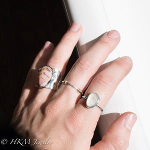 model wearing large bezel set raw cape may diamond ring in sterling silver  by HKM Jewelry