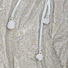 Load image into Gallery viewer, small medium and large raw cape may diamond necklaces in sterling bezels by hkm jewelry laying in sand
