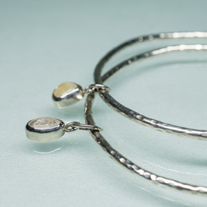 hammer textured sterling silver bangles with dangling quartz pebbles by hkm jewelry