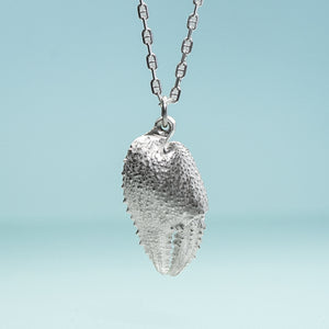 cast silver ghost crab claw in recycled silver on anchor chain by hkm jewelry