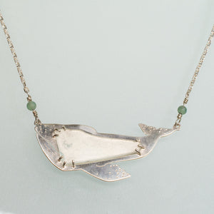 close up of grey whale necklace in sterling silver and sea glass with aventurine beads and anchor chain by hkm jewelry