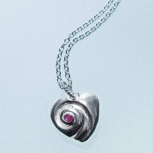 Heart of the Sea moon snail necklace by hkm jewelry with ruby july birthstone