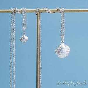 The Little Neck Clam Necklace is made from the molding and casting of a real "clam seed" in solid recycled silver by HKm Jewelry